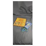 Wooden box with game and marbles with jacks