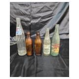 Fruit Bowl Soda plus other soda bottles.