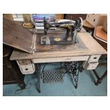 Singer treadle sewing machine fair condition.