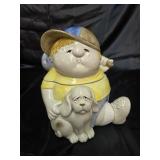 Boy with dog leaving home hobo style. Cookie Jar.