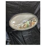Oval silver colored mirror 36 X 20 imches.