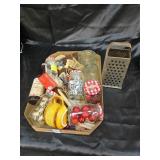 Christmas decorations stored in jars plus graters