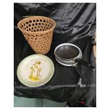 Holly ho by plate skillets and trash can