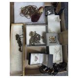 Flat of costume jewelry