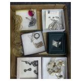 Flat of costume jewelry