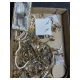 Flat of costume jewelry