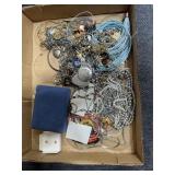 Flat of costume jewelry