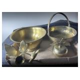 brass bowls, candle stick, and apple