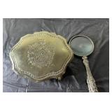 brass magnifying glass and trinket