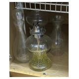 contents of cabinet - oil lamp, glass shade, etc