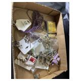 Flat of costume jewelry