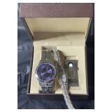 One mens watch in box with one ladies watch
