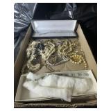 Flat of costume jewelry