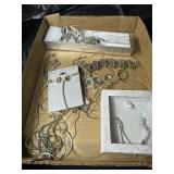 Flat of costume jewelry