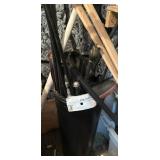 Black can full of curtain rods
