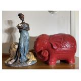Ceramic red elephant and woman with lion statue