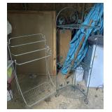 two metal stands including green plant stand