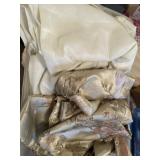 tote of various linens - mostly curtains