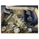 Flat of costume jewelry and glasses