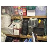 Middle shelf of Christmas decor and heaters
