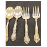 Pair of sterling spoons and forks. All sterling