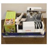 Can opener, knife sharpener and a veggie cutter