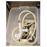 Hair dryers and shower head in a tote
