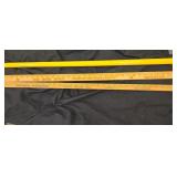Pare of yard sticks and a pole