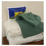 Pair of pillows, green throw and a pullow insert