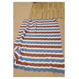 Mauve blue and cream colored coverlet