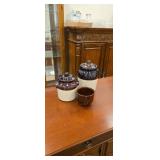 2 canisters and a brown dish