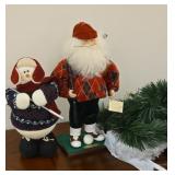 Santa Clause and snowman golfers and aome