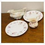 2 pretty saucers, gravy boat and creamer