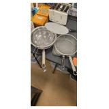 Group of deep fryer drain pans and a bowl