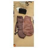 Pair of golf club bags and a brief case