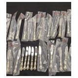 24 sterling handles knives with 18 in original
