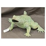 Oriental frog he might be a bank made of metal