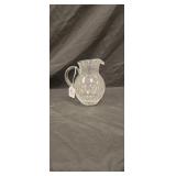 Clear vase with white chips approx 7 inches tall