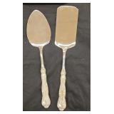 Pair of vintage servers with sterling handles.