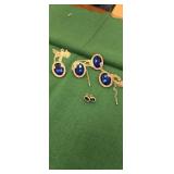 4 blue stone necklaces and a pair of earrings
