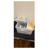 Tote of various light bulbs, flash lights and