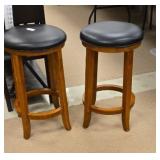 Pair of bar stools with black leather chairs