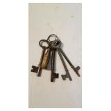 Set of skeleton keys in an old coke key ring