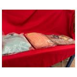 Three Packaged Sweaters