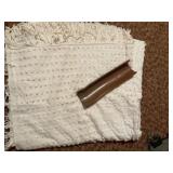 Fringed Textile and Wooden Trim
