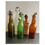 5 bottles, some w/ ceramic tops, tallest 12"