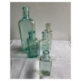 5 green glass bottles, tallest 8"H