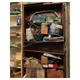 Shelf contents, only  glasswear, music sheets,