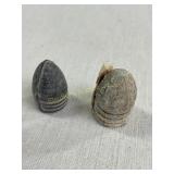 2 conical shaped minie balls, largest 1"