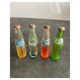 4 miniature soda bottles, 3" high